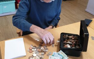Counting money at The Firs Nursing Home in Taunton